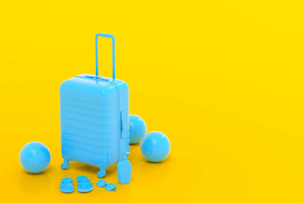 istock Colorful suitcase or baggage with beach accessories on yellow background. 1366601865