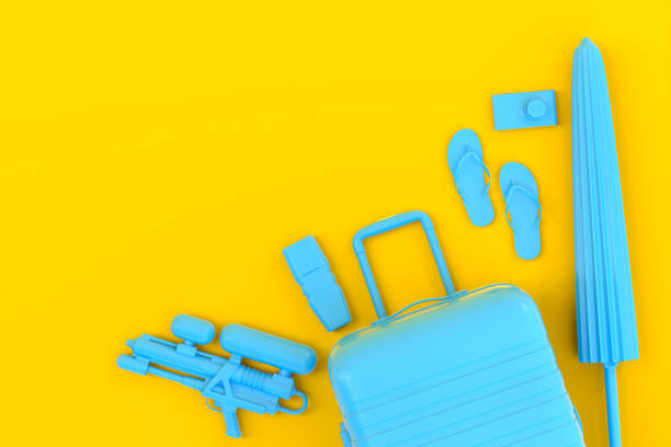 istock Colorful suitcase or baggage with beach accessories on yellow background. 1366601915