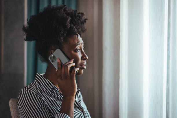 istock Outraged attractive employee talking on the phone 1366602100