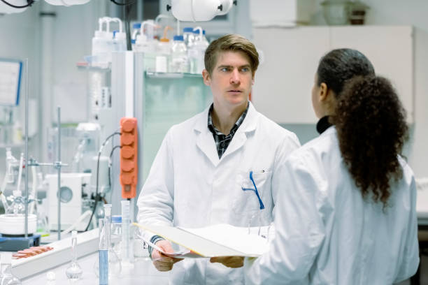 istock Two researchers discussing over test results in laboratory 1366602102