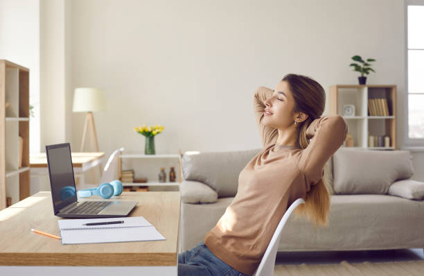 istock Woman putting her hands behind her head taking break after working with laptop or after studying. 1366602198