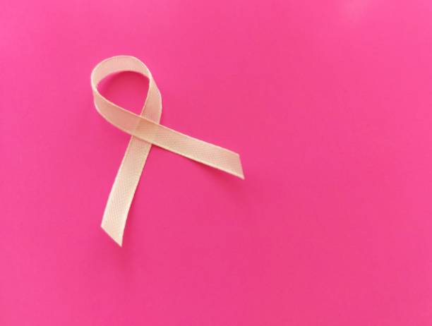 istock light AIDS awareness ribbon on pink background 1366602948