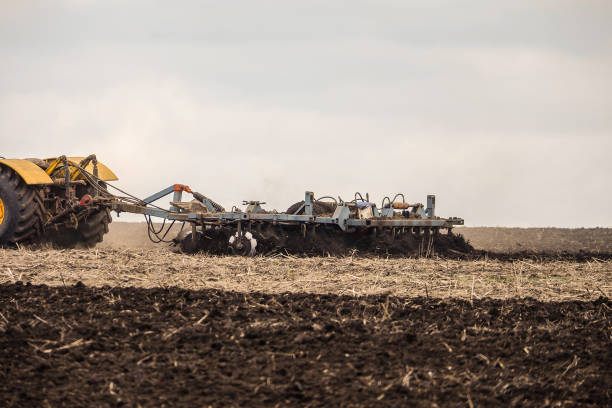 istock Cultivation of the soil with a disc harrow 1366603269