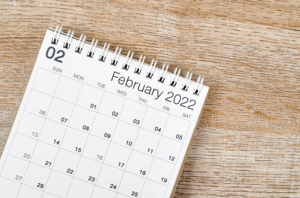 istock February 2022 desk calendar on wooden background. 1366603384