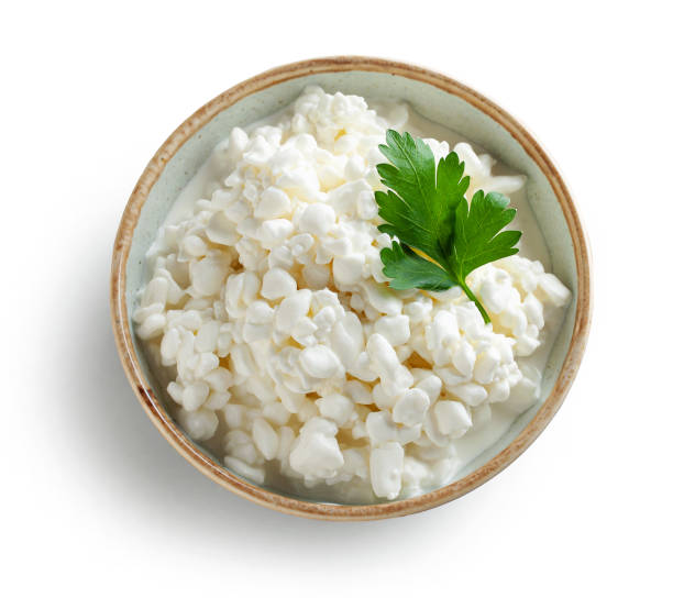 bowl of cottage cheese bowl of cottage cheese isolated on white background, top view COTTAGE CHEESE stock pictures, royalty-free photos & images