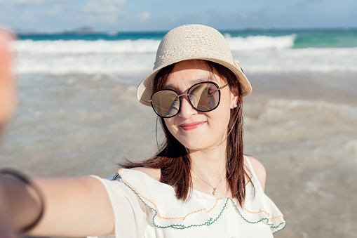 Portrait of beautiful asian woman at beach