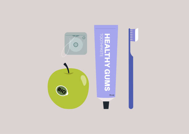 zestaw produktów do higieny jamy ustnej, tubka pasty do zębów, szczoteczka do zębów, nić dentystyczna i zielone jabłko - healthy gums obrazy stock illustrations