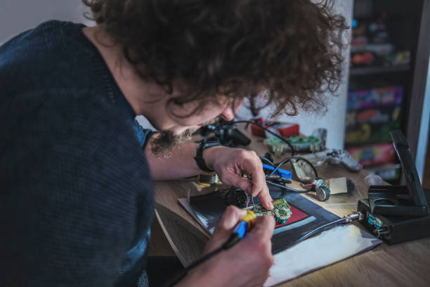 istock Repairing motherboard of a game controller 1366610020