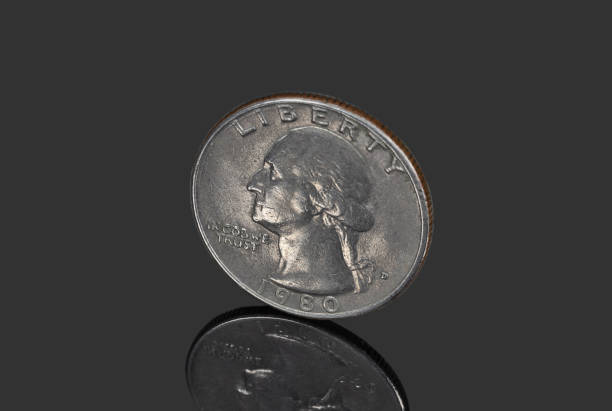 istock Quarter dollar coin close up 1366611505