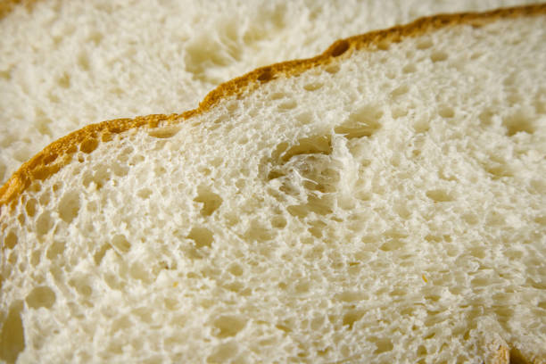 istock Slice of freshly baked wheat bread texture close up. 1366613188