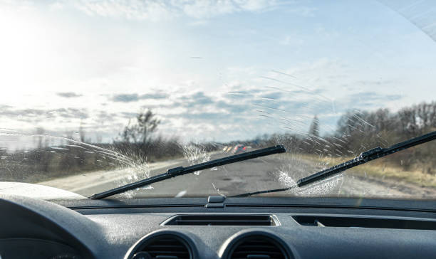 istock Car wipers clean windshields when driving in sunny weather. 1366614839