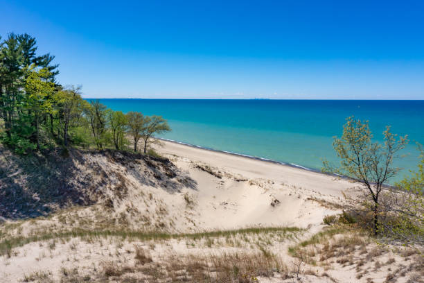 Indiana Dunes National Park Indiana Dunes National Park, Indiana, USA. The views of Lake Michigan and the sand dunes are popular beach and hiking attractions. sand dune stock pictures, royalty-free photos & images