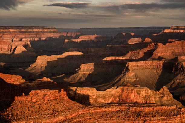 istock Red Tint Glows From Multiple Ridges In The Grand Canyon In Morning Light 1366615381
