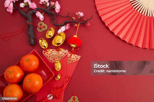 Chinese New Year Festival Decorations Orange Red Packet Plum Blossom And Lucky Money Translation Let Ten Thousand Wishes Come True Stock Photo - Download Image Now