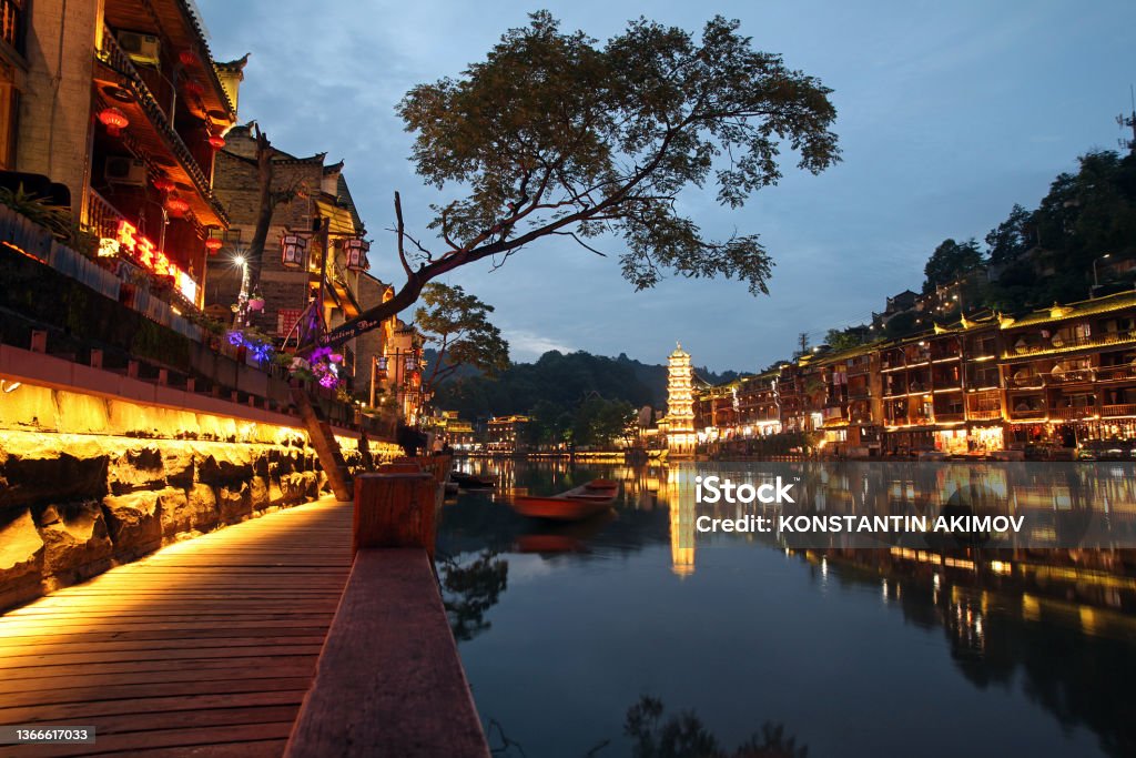 Fenghuang Hunan/China - June 20, 2017: Evening river embankment in the old city of Phoenix or Fenghuang County, Hunan Province, China China - East Asia Stock Photo