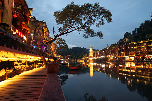 Fenghuang Hunan/China - June 20, 2017: Evening river embankment in the old city of Phoenix or Fenghuang County, Hunan Province, China