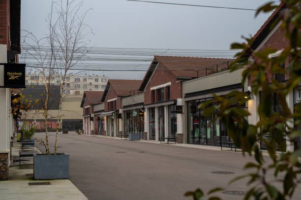 Romainville cityscape Romainville, France - January 13 2022: Paddock Paris EST Factory Outlet village near Paris on a cloudy winter morning. reebok stock pictures, royalty-free photos & images