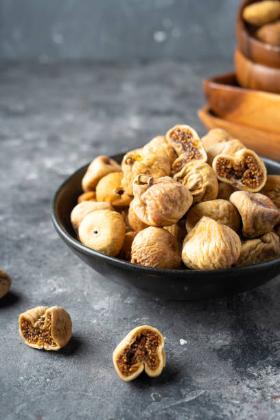 Delicious dried figs in a bowl. Healthy food stock photo