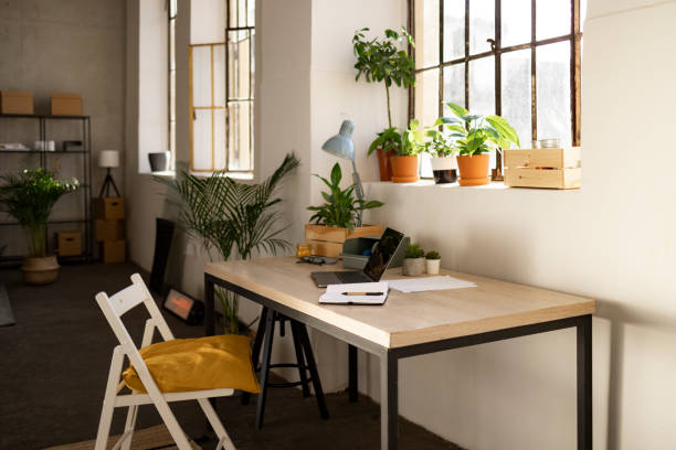 istock Empty home office with no people and a laptop on the table 1366621969