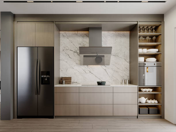 istock Brown-and-beige kitchen with large black refrigerator and extractor hood with oven on a white marble wall background. 1366623005