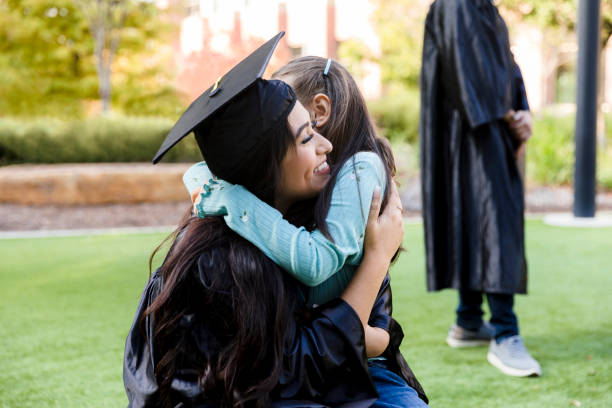 istock After she graduates from college, aunt hugs niece 1366623659