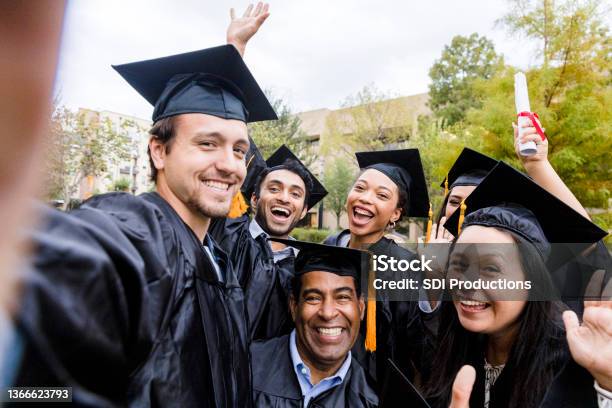 Diverse Friends Group Takes Joyful Photo After Graduation Stock Photo - Download Image Now