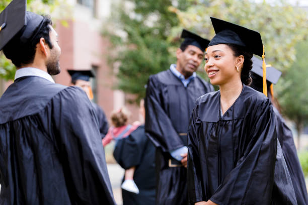 istock After ceremony, graduates meet outside to talk together 1366623887