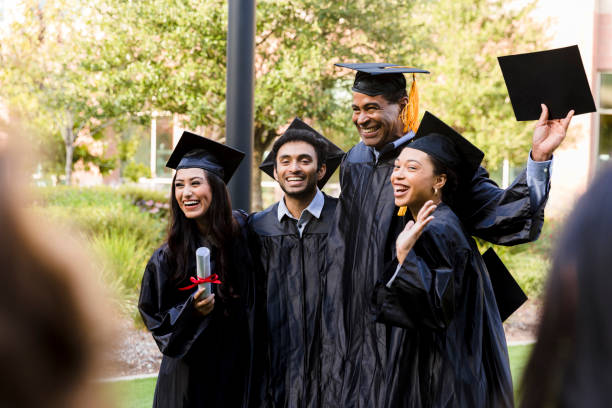 istock Group of graduates pose for photo 1366624250