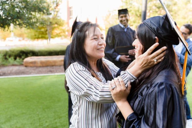 istock Proud mother on daughter's graduation day 1366624386