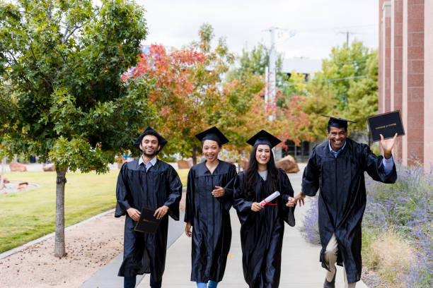 istock Diverse friends group walks together after graduation 1366624424