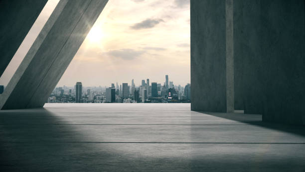 Space for products is shown in the concrete hallway with the city in the evening background. Space for products is shown in the concrete hallway with the city in the evening background.3D rendering. empty dealership interior stock pictures, royalty-free photos & images