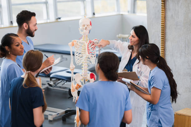 istock Multi-ethnic group of medical students takes notes during lecture 1366626300