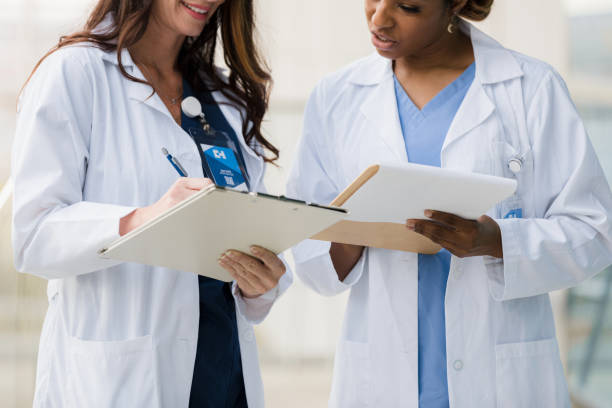 istock Female doctors consult about patient treatment 1366626399