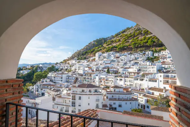 Mijas village skyline arch in Costa del Sol beautiful Mediterranean white village whitewashed with flower pots in Malaga of Andalusia of Spain
