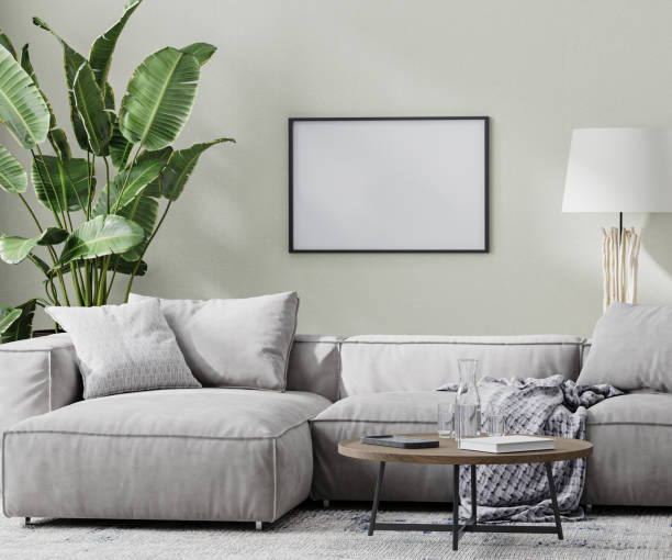 istock empty horizontal picture frame mock up in modern room with gray sofa and coffee table and tropical plant, 3d rendering 1366628082