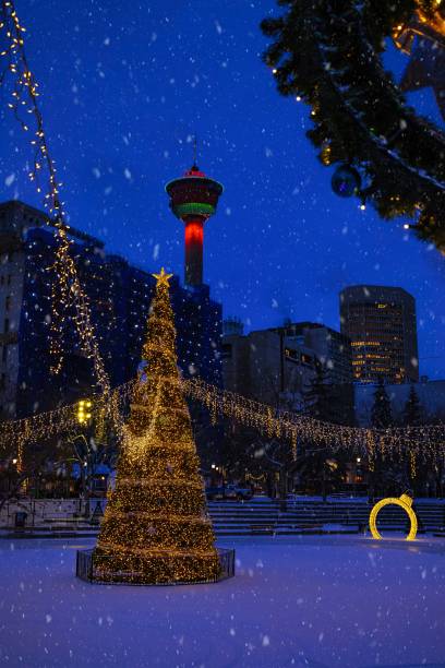 istock Snow Falling Over Holiday Decorations At Olympic Plaza 1366629115