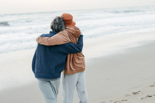 istock Senior couple enjoying time on the beach 1366629161
