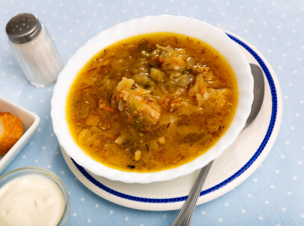 istock Shchi, cabbage soup cooked on mushroom broth with pork and sour cream 1366630369
