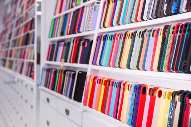 istock Phone cases on shelves in store 1366630375