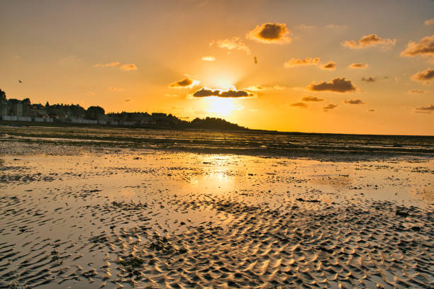 istock dramatic sunset / waterfront / beach / beauty in nature 1366630438