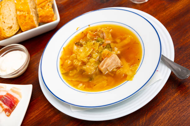 istock Thick cabbage soup shchi with pork cooked in mushroom broth 1366630984