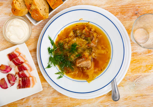 istock Thick cabbage soup shchi with pork cooked in mushroom broth 1366630985