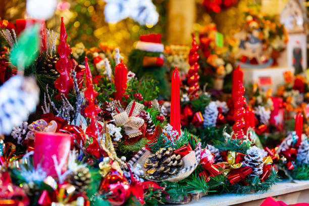 istock Christmas decorations with candles at outdoors market 1366631026