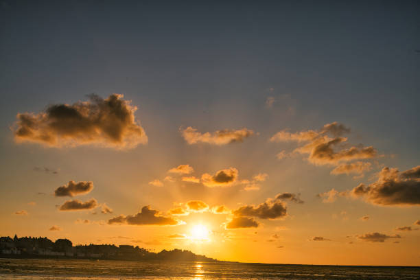 istock dramatic sunset / waterfront / beach / beauty in nature 1366632019