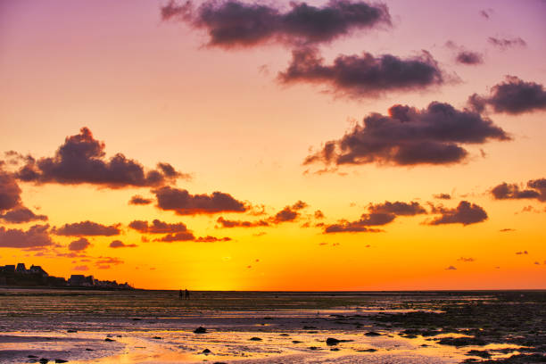 istock dramatic sunset / waterfront / beach / beauty in nature 1366632062