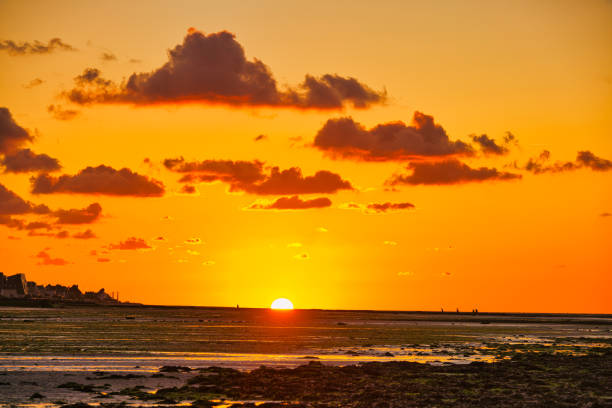 istock dramatic sunset / waterfront / beach / beauty in nature 1366632201
