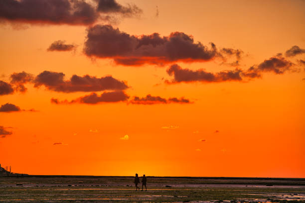 Looking at dramatic sunset over the north sea at a beachfront in the region Normandy, France.