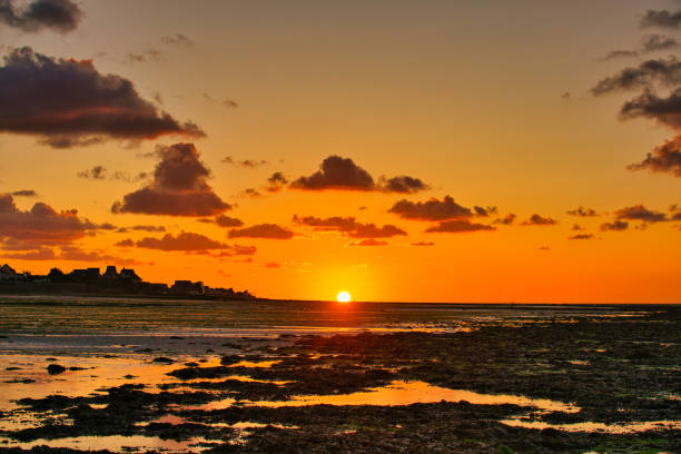 istock dramatic sunset / waterfront / beach / beauty in nature 1366634524