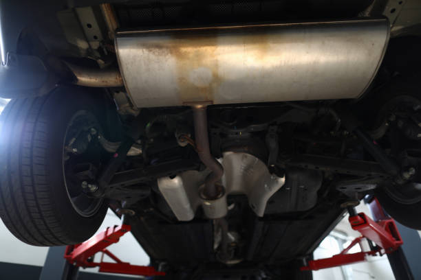 istock Bottom of car with muffler on lift 1366635017