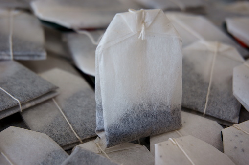 The photo of expired tea bags represents the concepts of food safety, health risk and poor quality products.